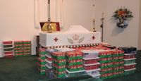 Operation Christmas Child, wrapped boxes on altar
